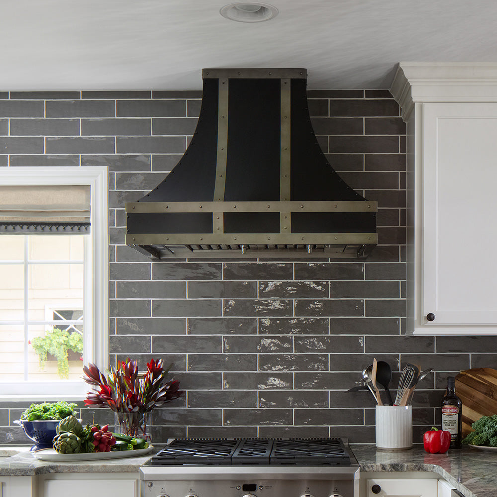 black range hood installed in traditional kitchen