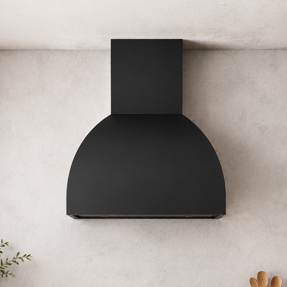 modern dome hood in black finish installed in stucco kitchen