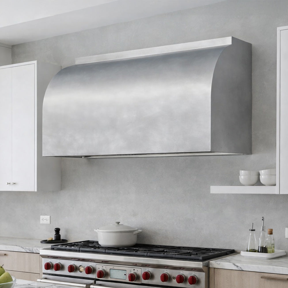 modern barrel range hood in stainless steel installed in high end kitchen