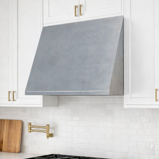 modern stainless steel vent hood in white kitchen
